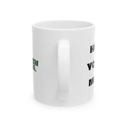 White mug with black text on a white background