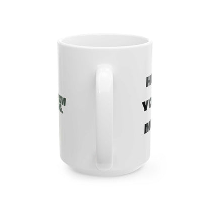 White mug with black text on a white background